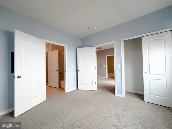 a view of an empty room and closet