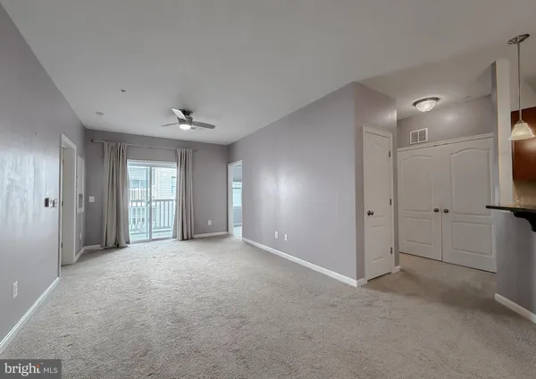 a view of empty room with windows