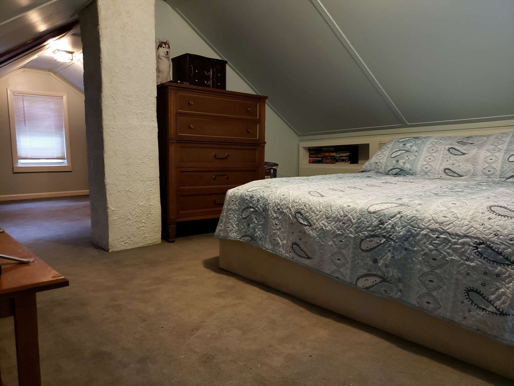 32 Birch Road Natick, MA 01760 - Photo 22 of 38 a bedroom with a bed and a television