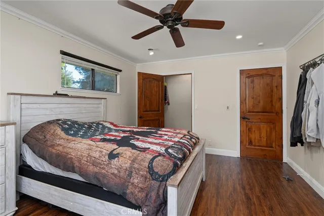 a view of walk in closet with clothes