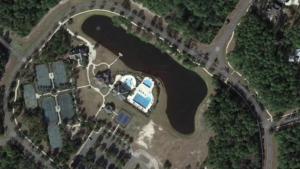 an aerial view of a house with a garden