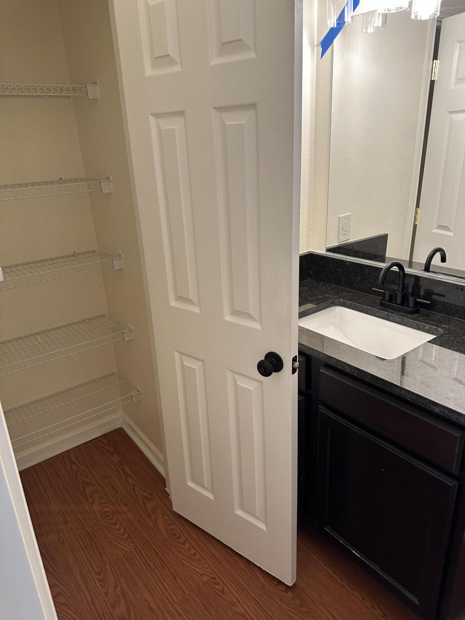 1150 Airport Road, Unit 138 Destin, FL 32541 - Photo 9 of 16 a bathroom with a sink and a mirror
