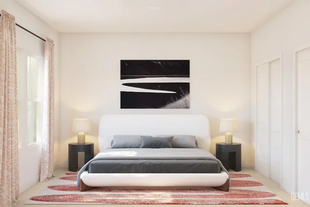 a bedroom with furniture and a window