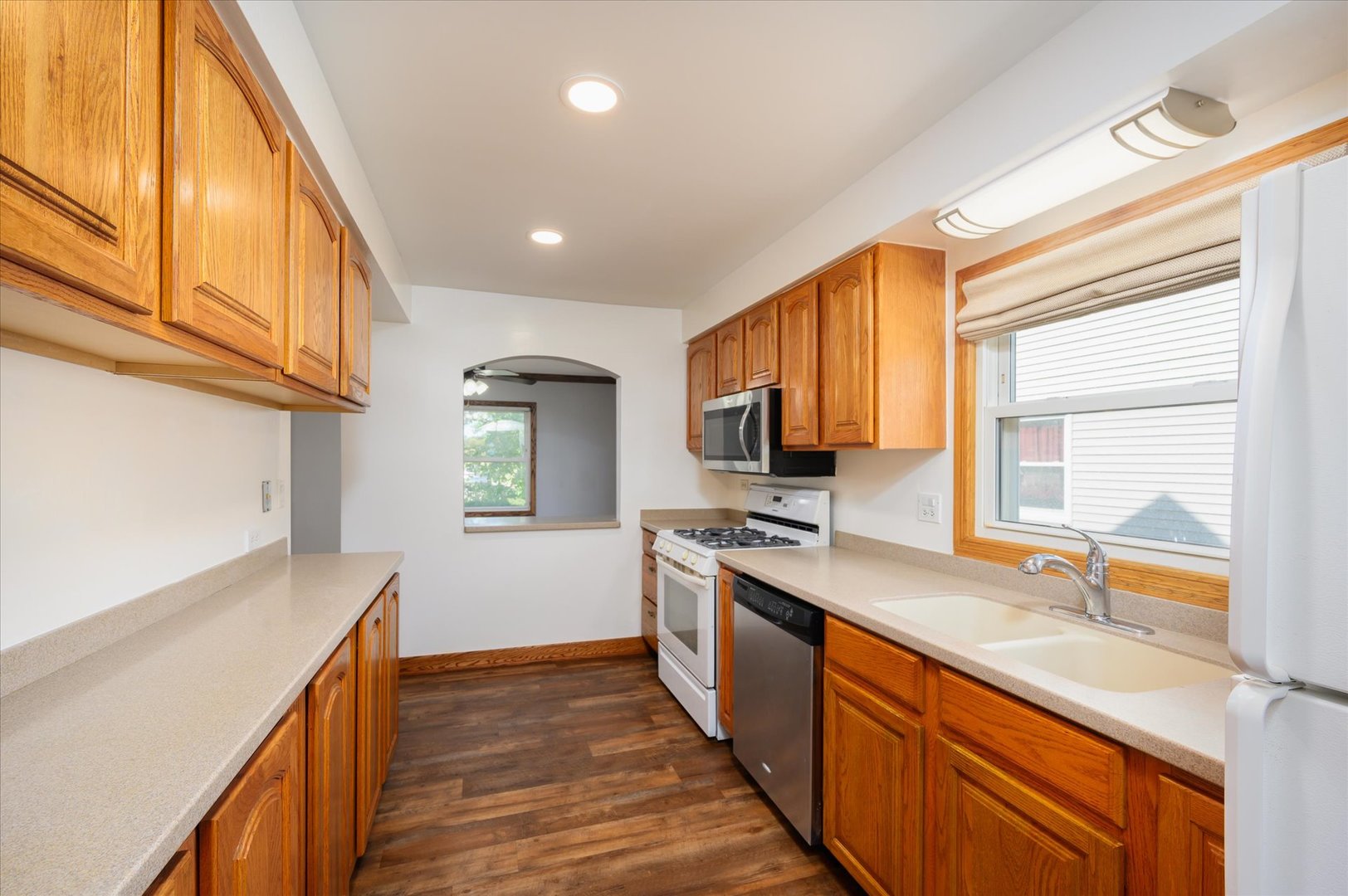 1037 Spring Road Elmhurst, IL 60126 - Photo 5 of 36 a kitchen with stainless steel appliances granite countertop a sink stove and cabinets