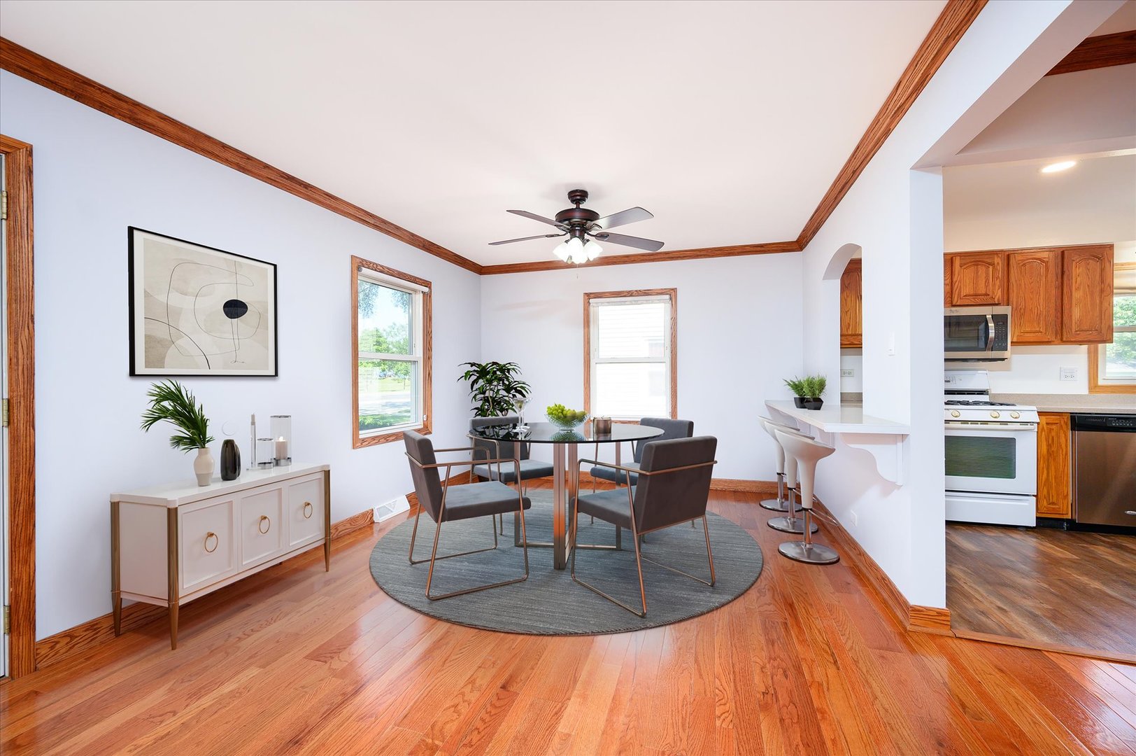 1037 Spring Road Elmhurst, IL 60126 - Photo 7 of 36 a living room with furniture a large window and wooden floor