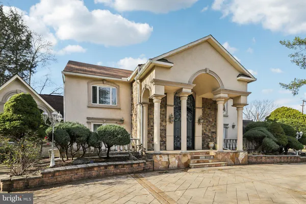 a front view of a house with yard