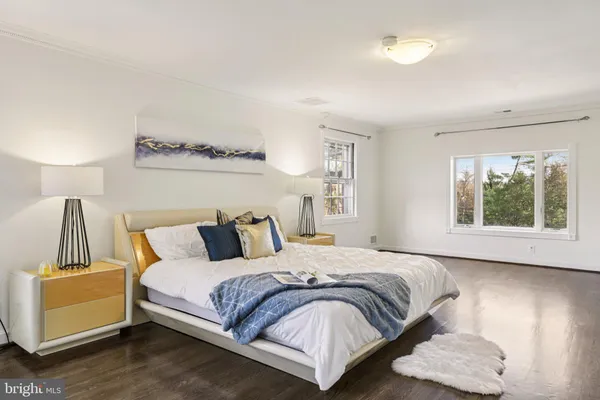 a bedroom with a bed and a table