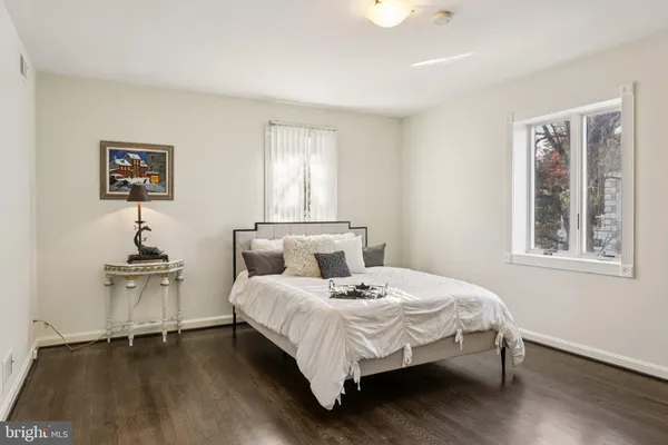 a kitchen with cabinets and chairs