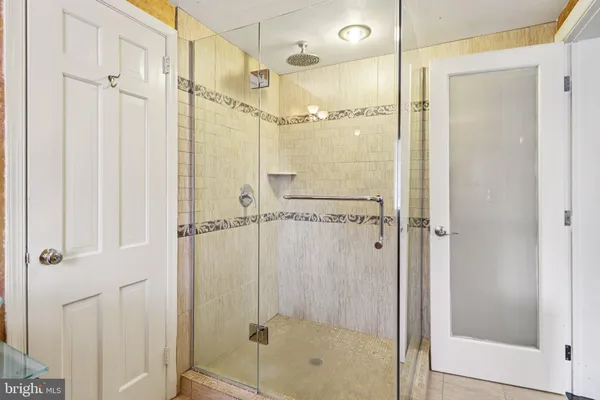 a view of a patio with table and chairs with wooden fence and plants