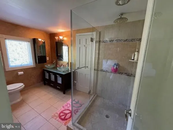 a swimming pool with outdoor seating and yard