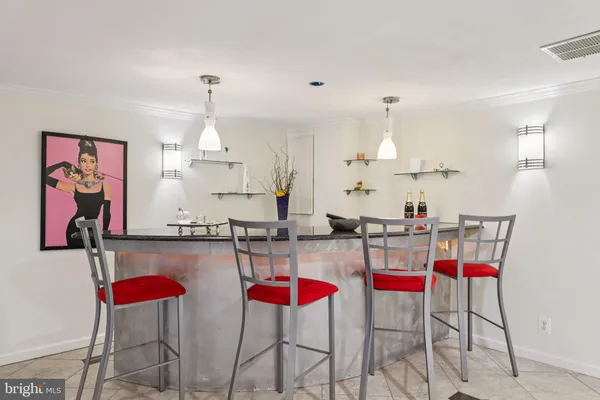 a view of a garden with potted plants and large trees