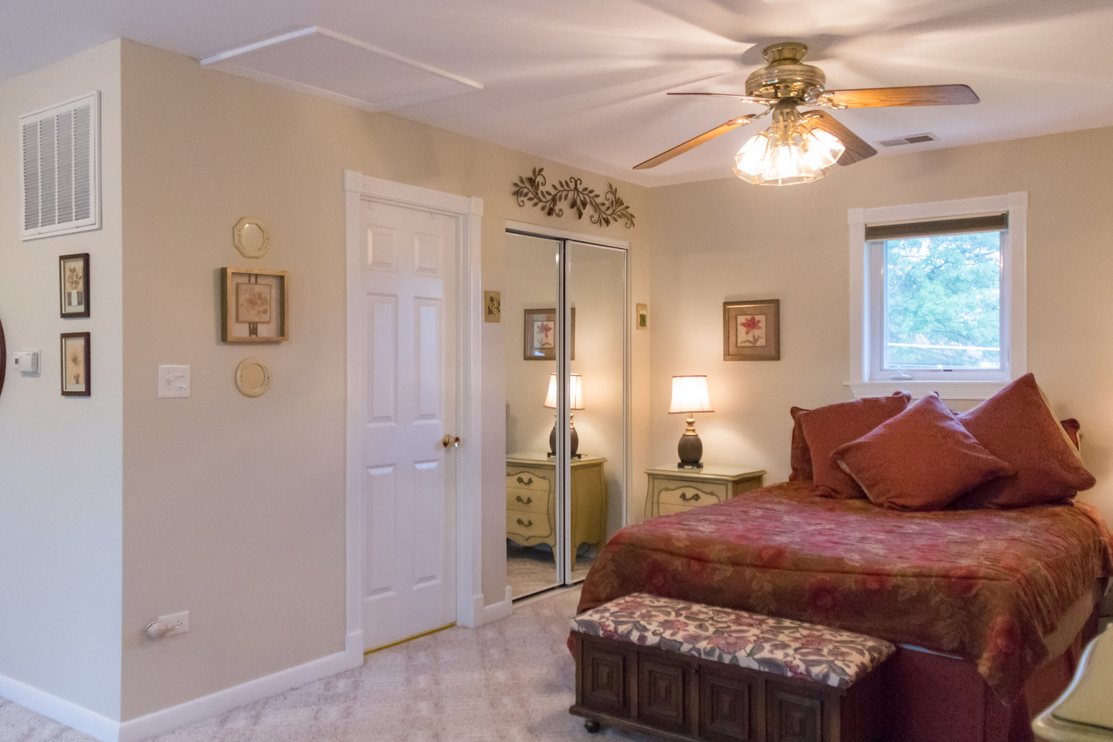 15254 Arroyo Drive Oak Forest, IL 60452 - Photo 22 of 39 a bedroom with a bed and a chandelier