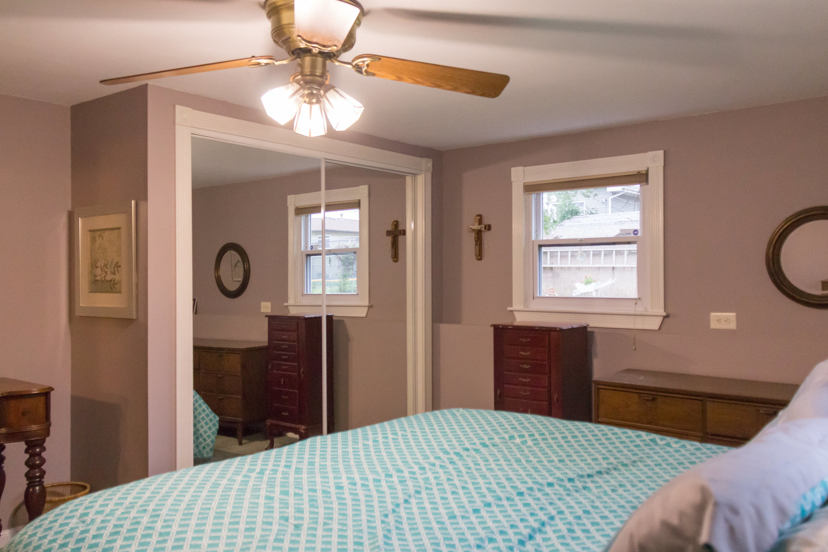 15254 Arroyo Drive Oak Forest, IL 60452 - Photo 32 of 39 a bedroom with a bed and a chandelier