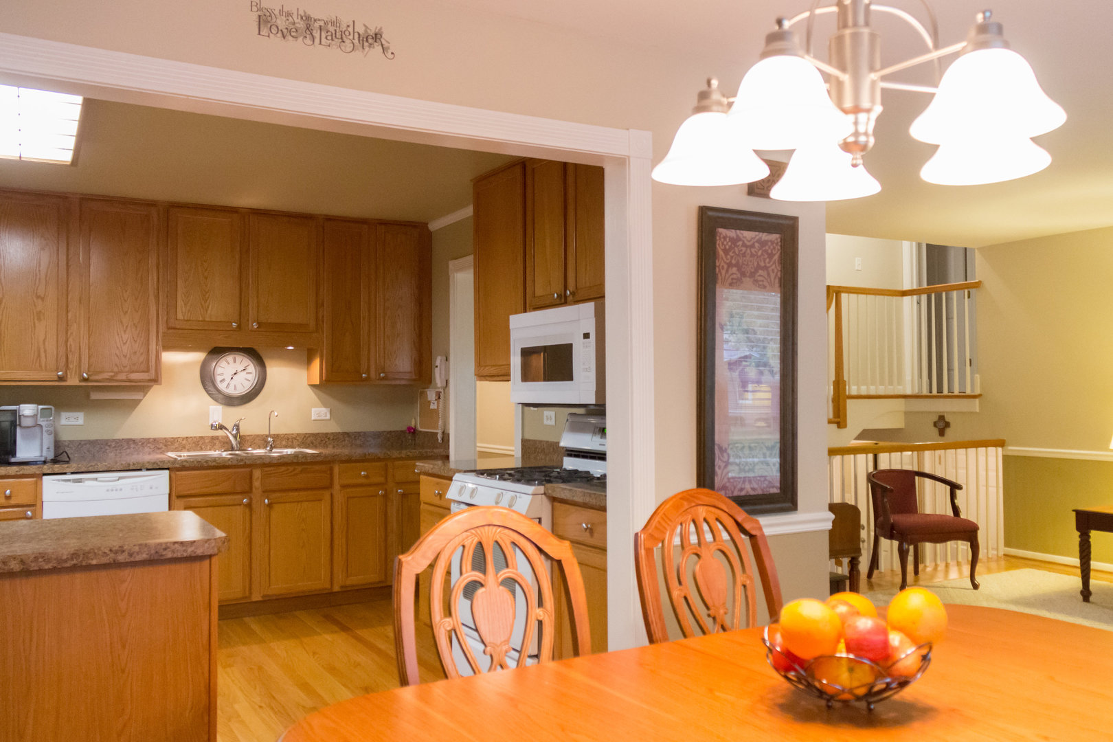 15254 Arroyo Drive Oak Forest, IL 60452 - Photo 8 of 39 a kitchen with a table chairs and a chandelier