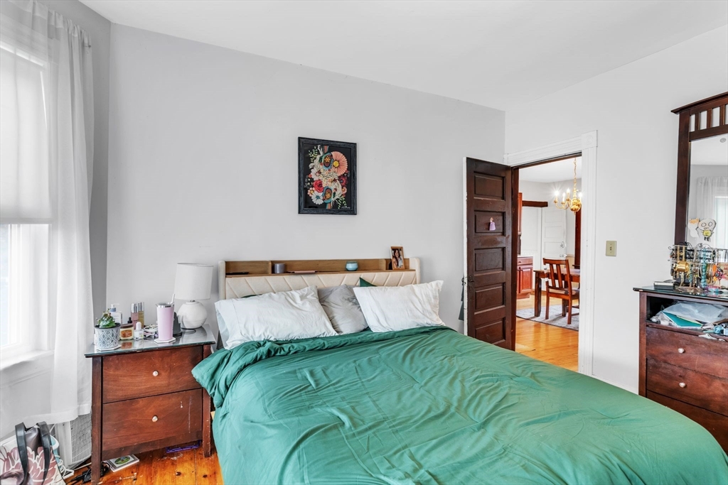47 Harold Street North Andover, MA 01845 - Photo 18 of 38 a bedroom with a bed and a view of kitchen