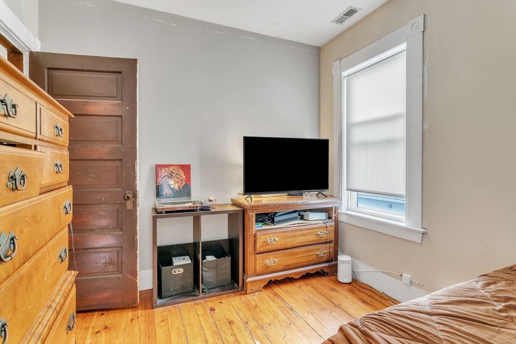 47 Harold Street North Andover, MA 01845 - Photo 20 of 38 a room with furniture and a flat screen tv