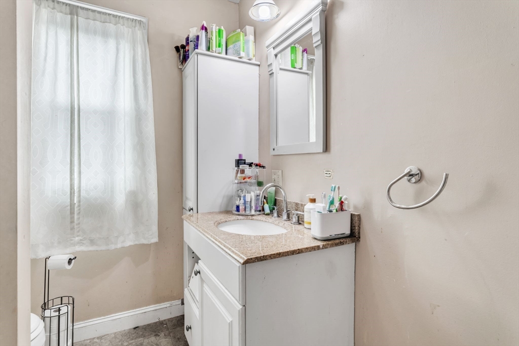 47 Harold Street North Andover, MA 01845 - Photo 22 of 38 a bathroom with a sink and a mirror