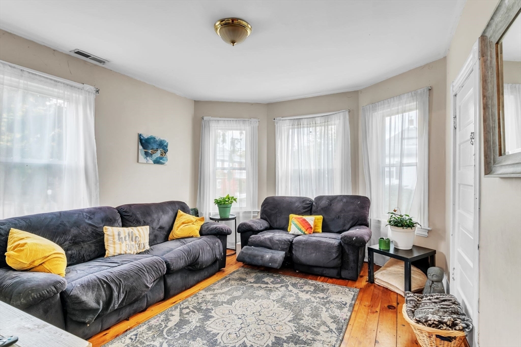 47 Harold Street North Andover, MA 01845 - Photo 6 of 38 a living room with furniture and a couch