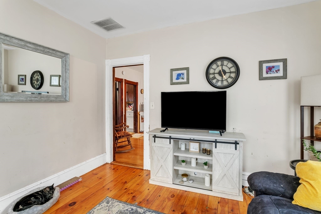 47 Harold Street North Andover, MA 01845 - Photo 9 of 38 a living room with furniture and a flat screen tv