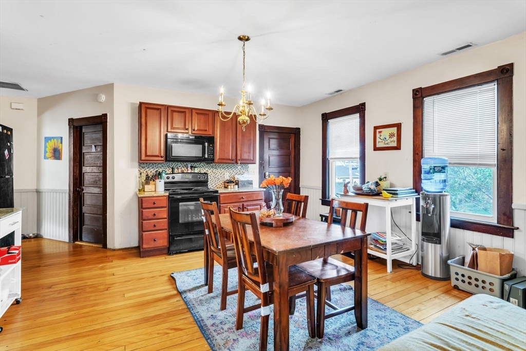 47 Harold Street North Andover, MA 01845 - Photo 10 of 38 a view of a dining room with furniture window and wooden floor