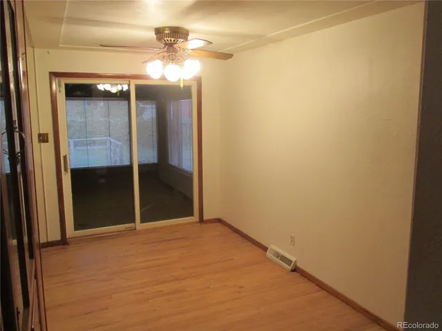 a view of an empty room with a bathroom
