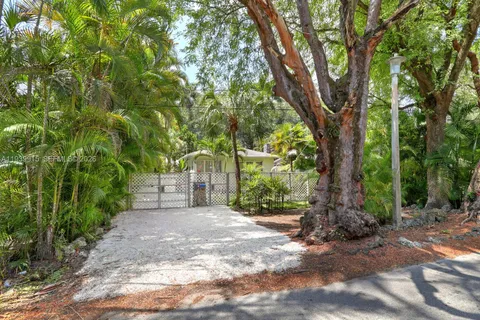 a view of a tree in front of a house