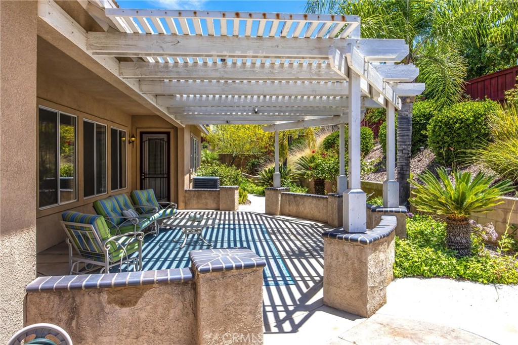 8710 Windmill Place Riverside, CA 92508 - Photo 52 of 66 a view of a patio with couches table and chairs and potted plants