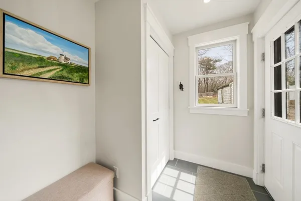 a view of hallway with window and hallway