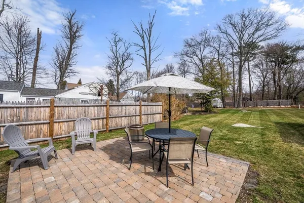 a view of a backyard with a sitting area and furniture