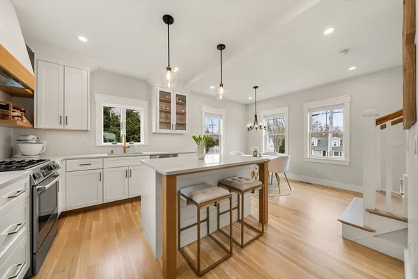 a kitchen with stainless steel appliances granite countertop counter space a sink and a refrigerator