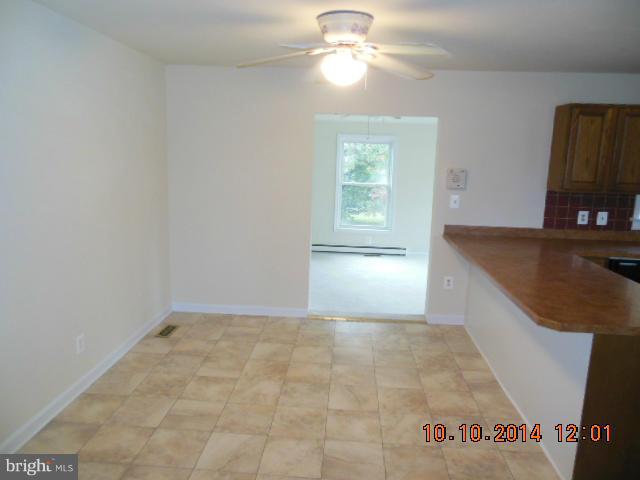 205 Berea Church Road Fredericksburg, VA 22406 - Photo 11 of 23 an empty room with windows and fan
