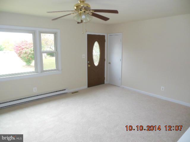 205 Berea Church Road Fredericksburg, VA 22406 - Photo 16 of 23 an empty room with windows and fan