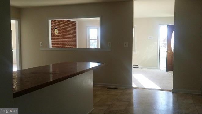 205 Berea Church Road Fredericksburg, VA 22406 - Photo 4 of 23 a view of a hallway with wooden floor and a window