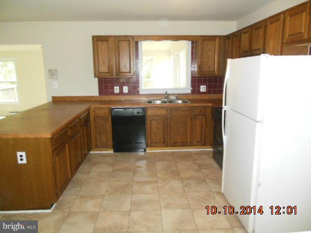 205 Berea Church Road Fredericksburg, VA 22406 - Photo 5 of 23 a kitchen with a refrigerator and a sink