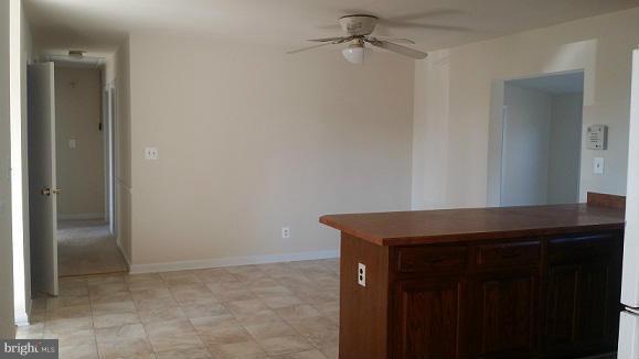 205 Berea Church Road Fredericksburg, VA 22406 - Photo 6 of 23 a room that has a table and cabinets