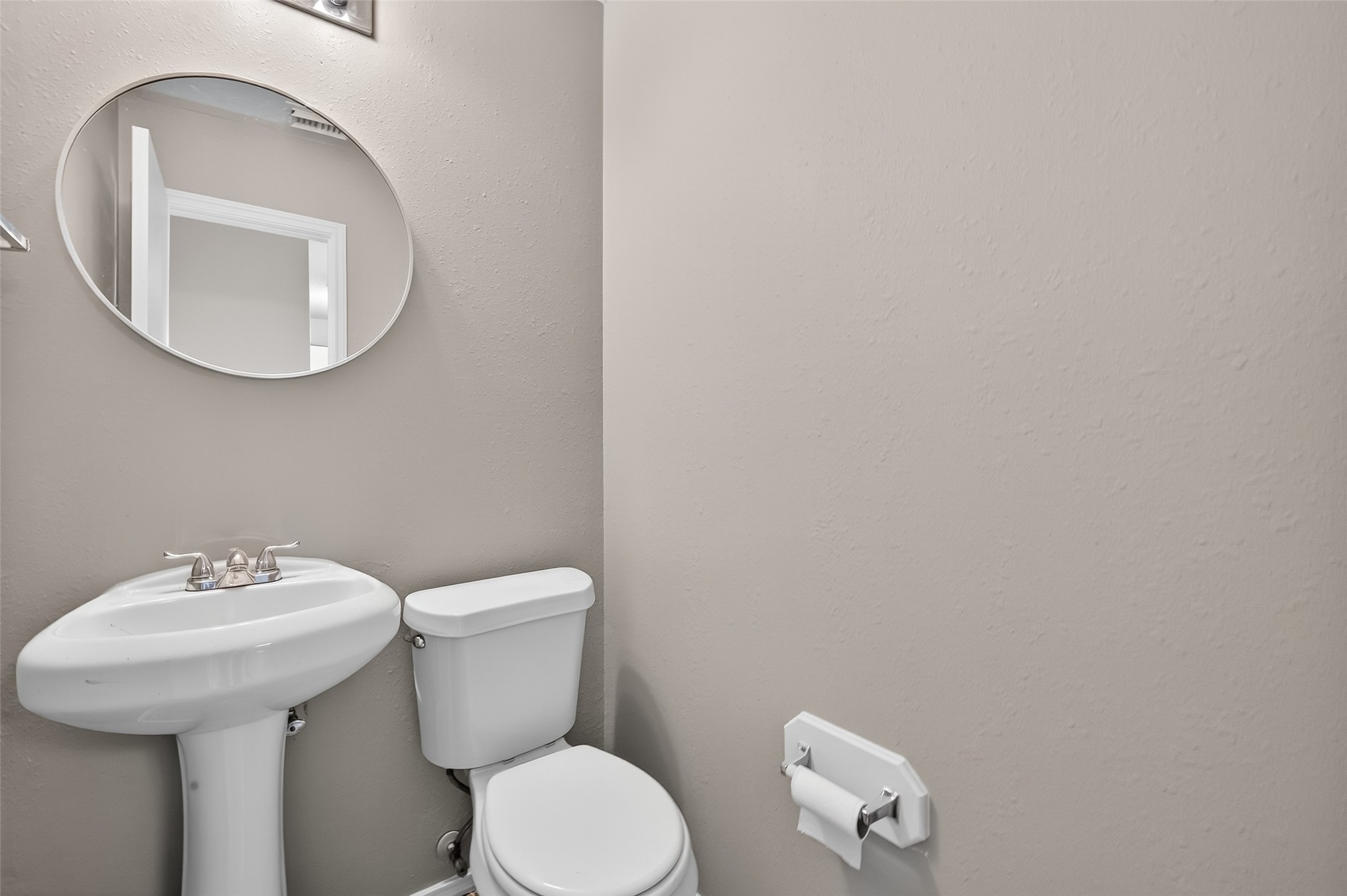 1107 Pennygent Lane Channelview, TX 77530 - Photo 16 of 40 a white toilet sitting next to a bathroom sink