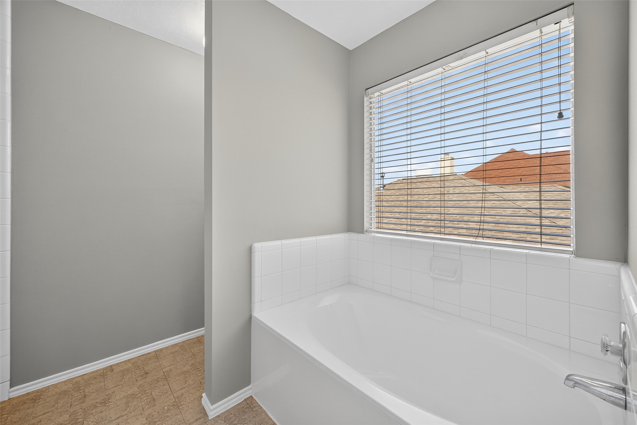 1107 Pennygent Lane Channelview, TX 77530 - Photo 30 of 40 a white bath tub sitting next to a window