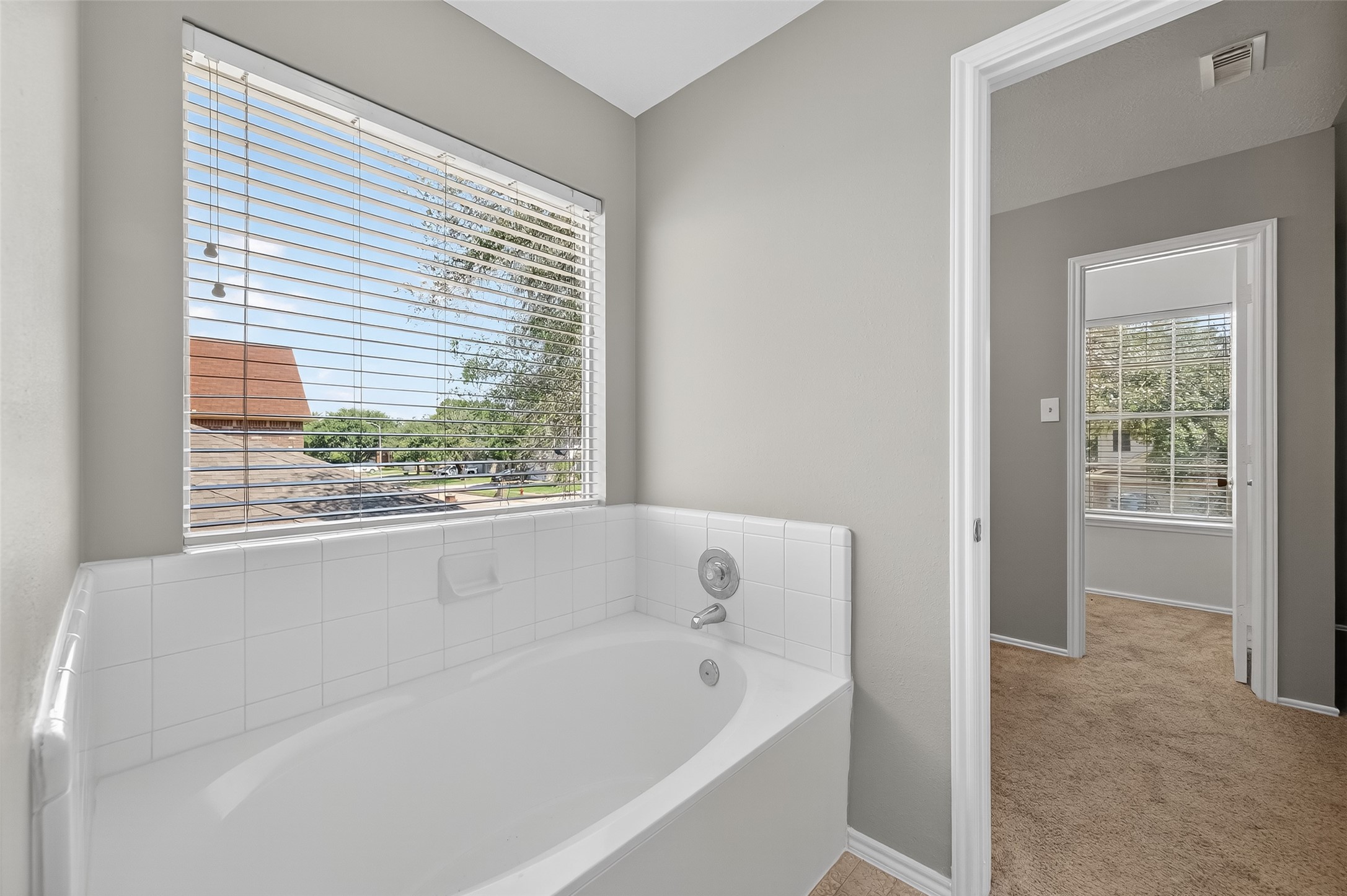 1107 Pennygent Lane Channelview, TX 77530 - Photo 31 of 40 a white bath tub sitting next to a window