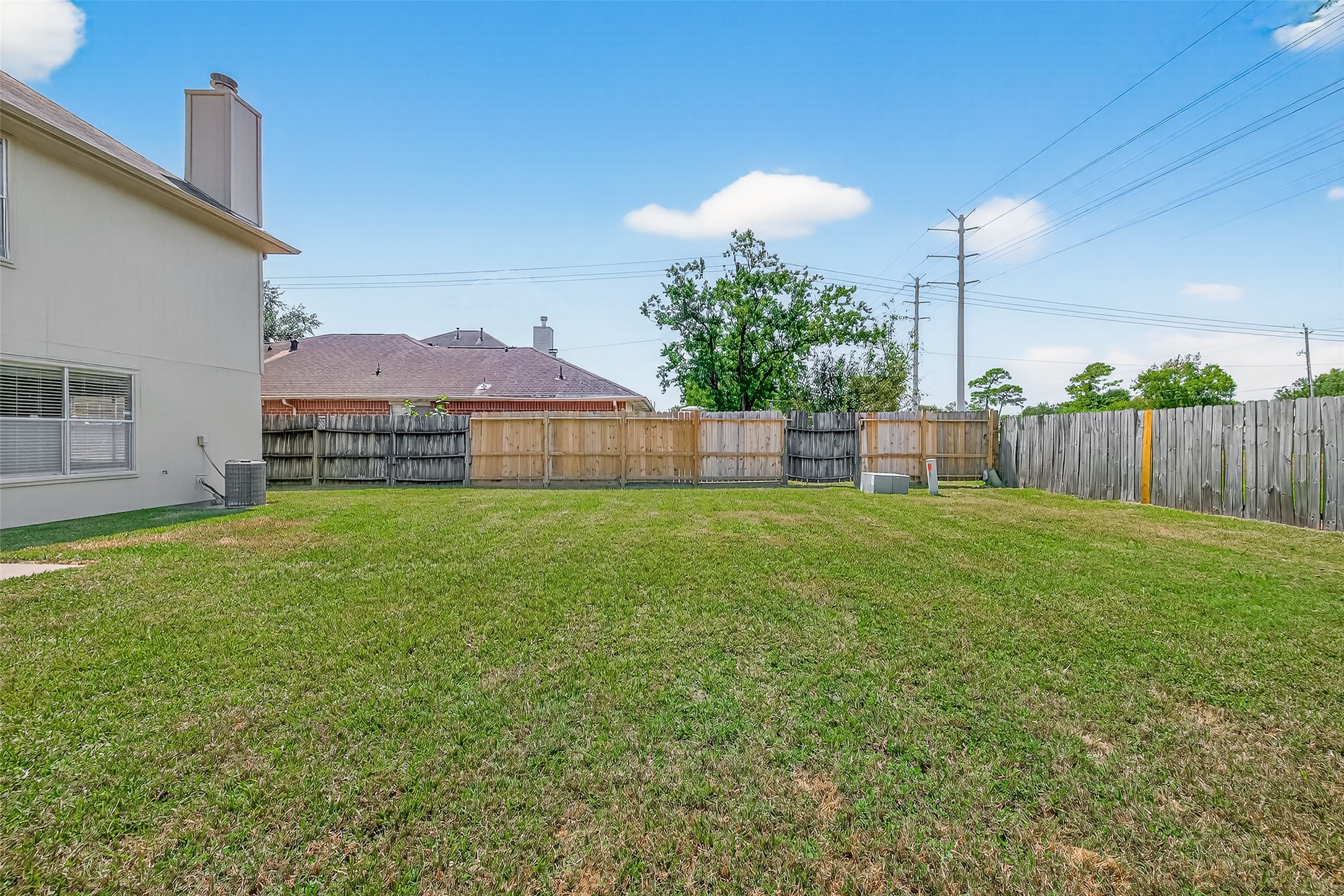 1107 Pennygent Lane Channelview, TX 77530 - Photo 35 of 40 a view of a house with a yard