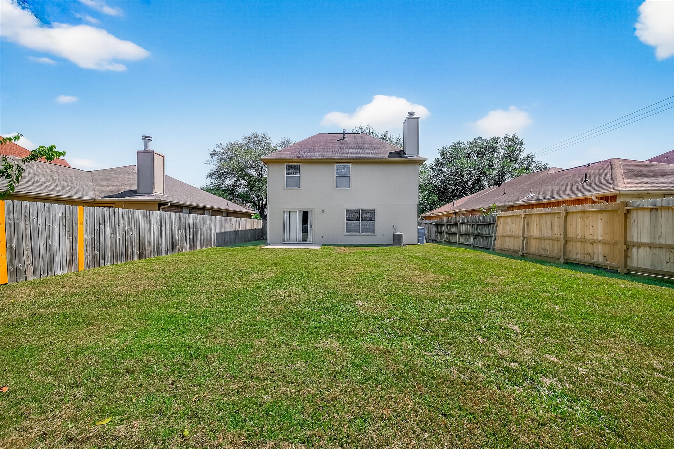 1107 Pennygent Lane Channelview, TX 77530 - Photo 37 of 40 a view of a backyard with a garden and deck