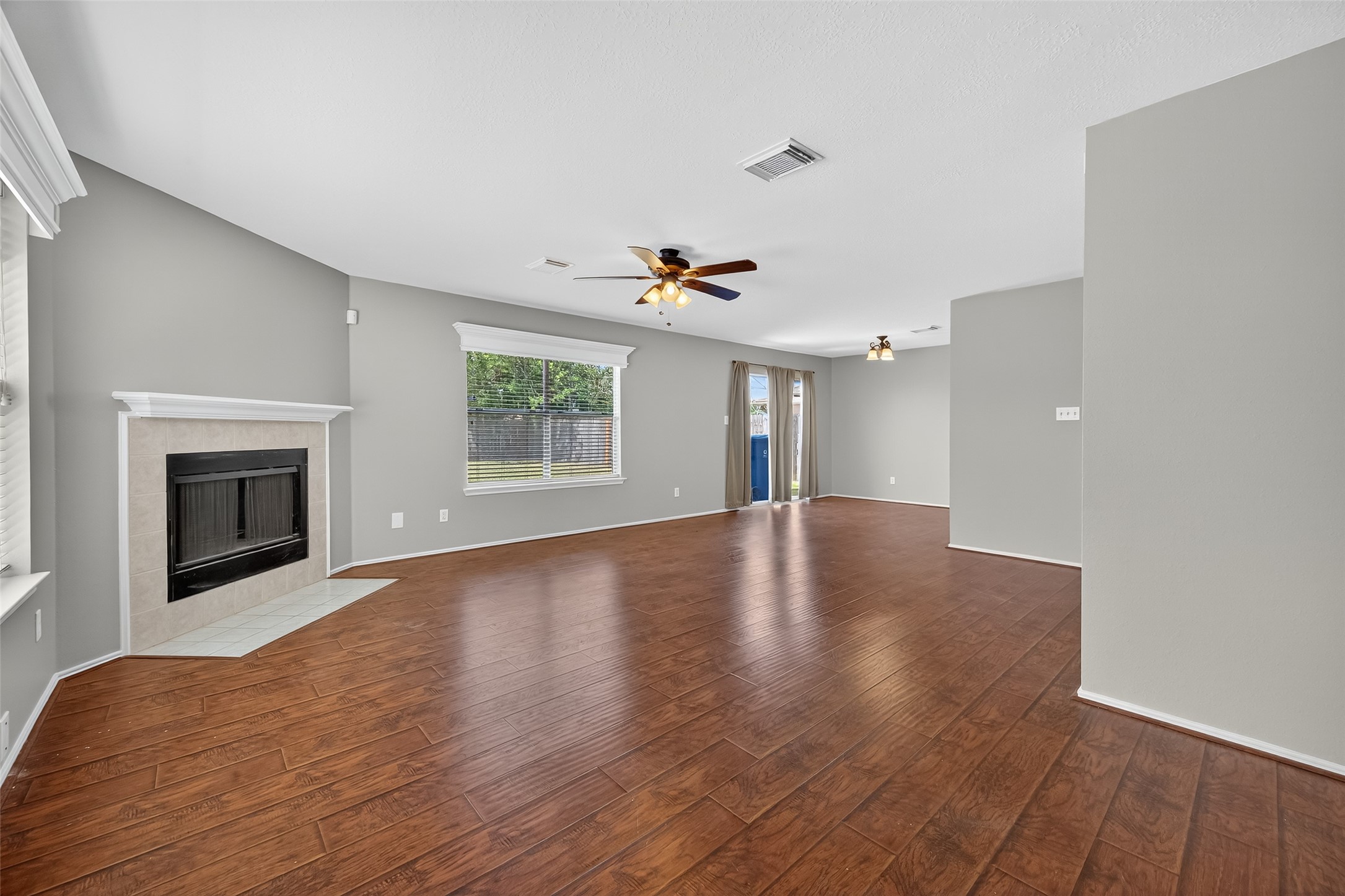 1107 Pennygent Lane Channelview, TX 77530 - Photo 6 of 40 a view of empty room with wooden floor and fireplace