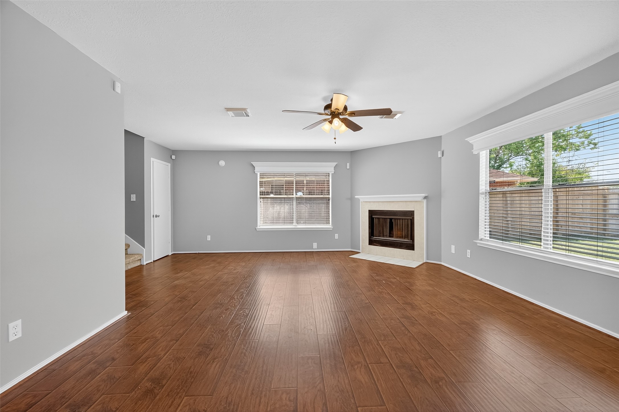 1107 Pennygent Lane Channelview, TX 77530 - Photo 8 of 40 a view of an empty room with a window and wooden floor