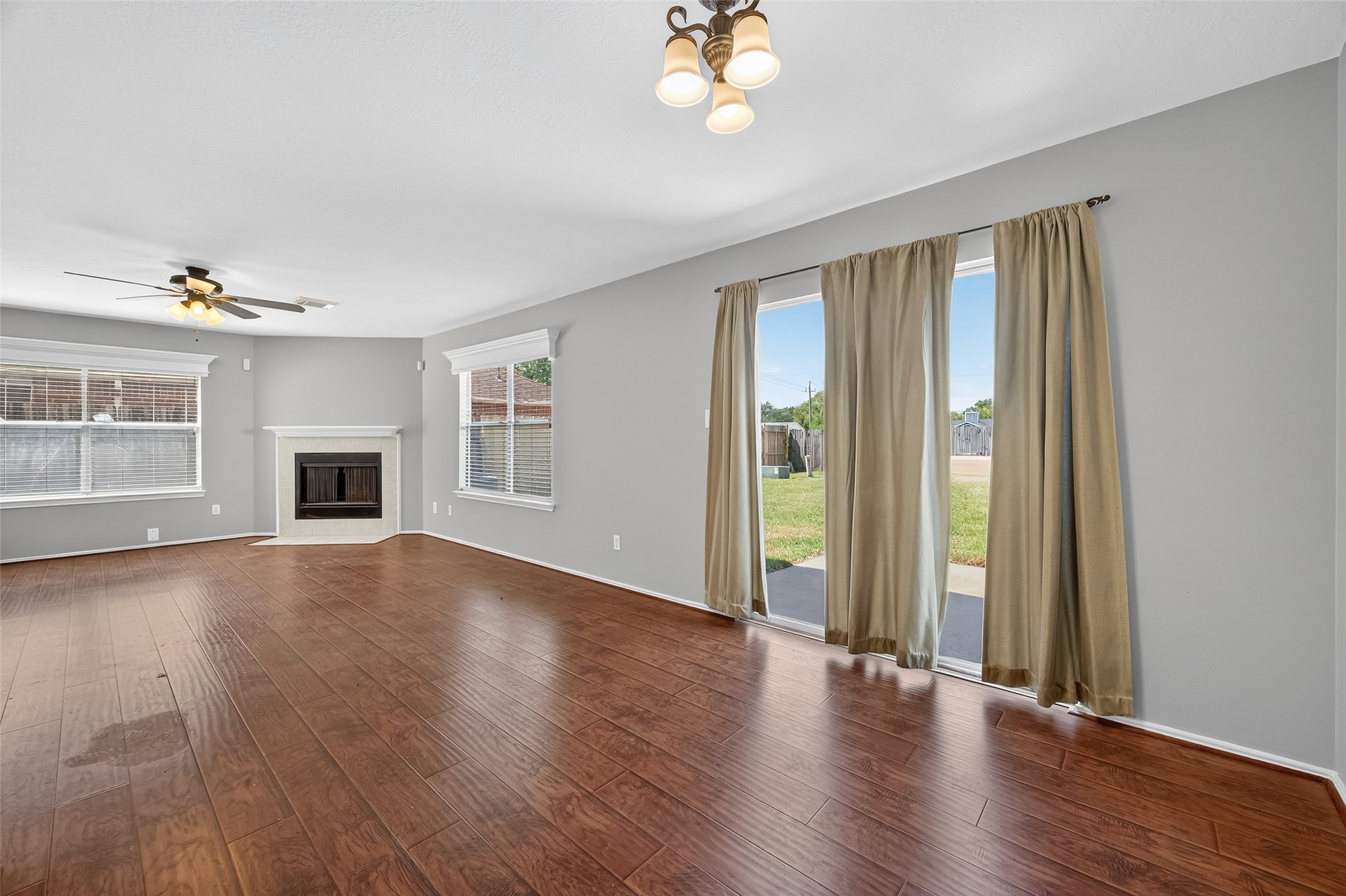 1107 Pennygent Lane Channelview, TX 77530 - Photo 10 of 40 an empty room with wooden floor and windows
