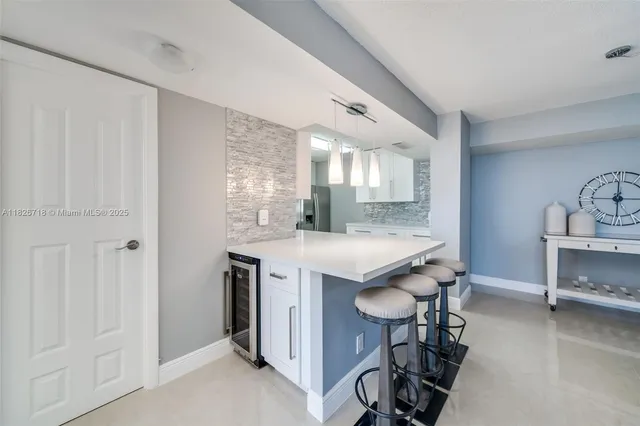 a view of kitchen island wooden floor and chair
