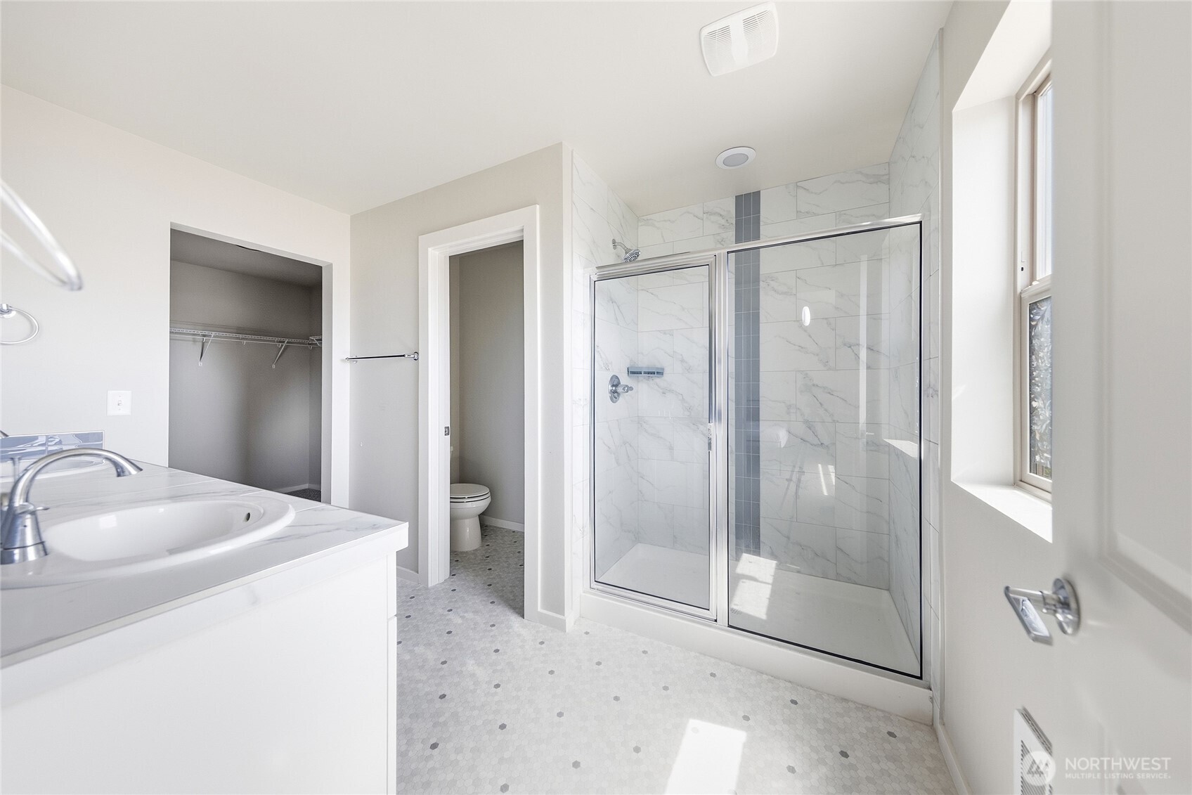 1066 Southwest 99th Place, Unit 55 Seattle, WA 98106 - Photo 15 of 21 a bathroom with a shower sink and mirror