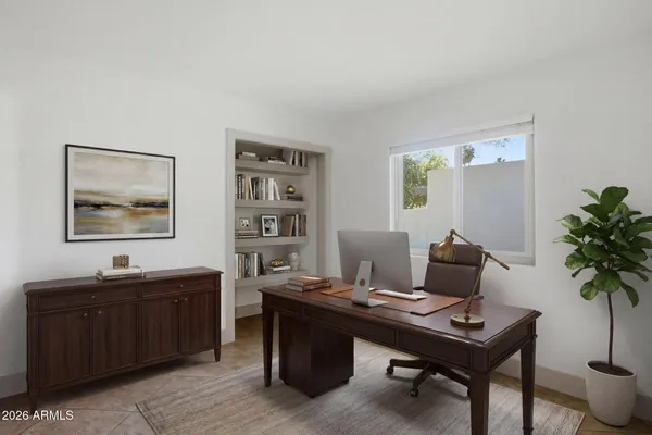 a view of a workspace with furniture