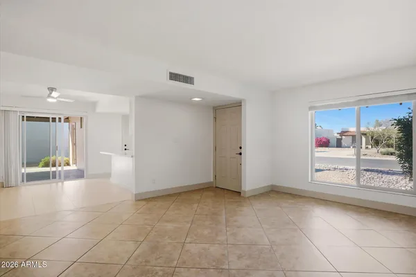 a view of an empty room and a window
