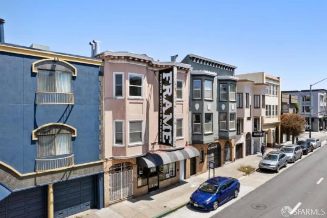 1926-1930 Lombard Street San Francisco, CA 94123 - Photo 12 of 26 a front view of a building with glass windows