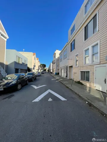 a view of a street with cars