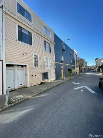a view of a street with a building